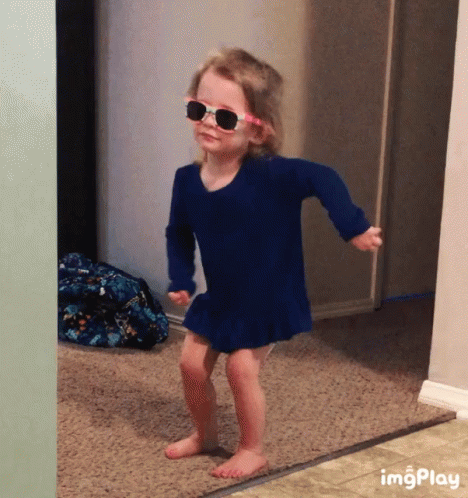 Cute little girl dancing, wearing sunglasses. GIF.
