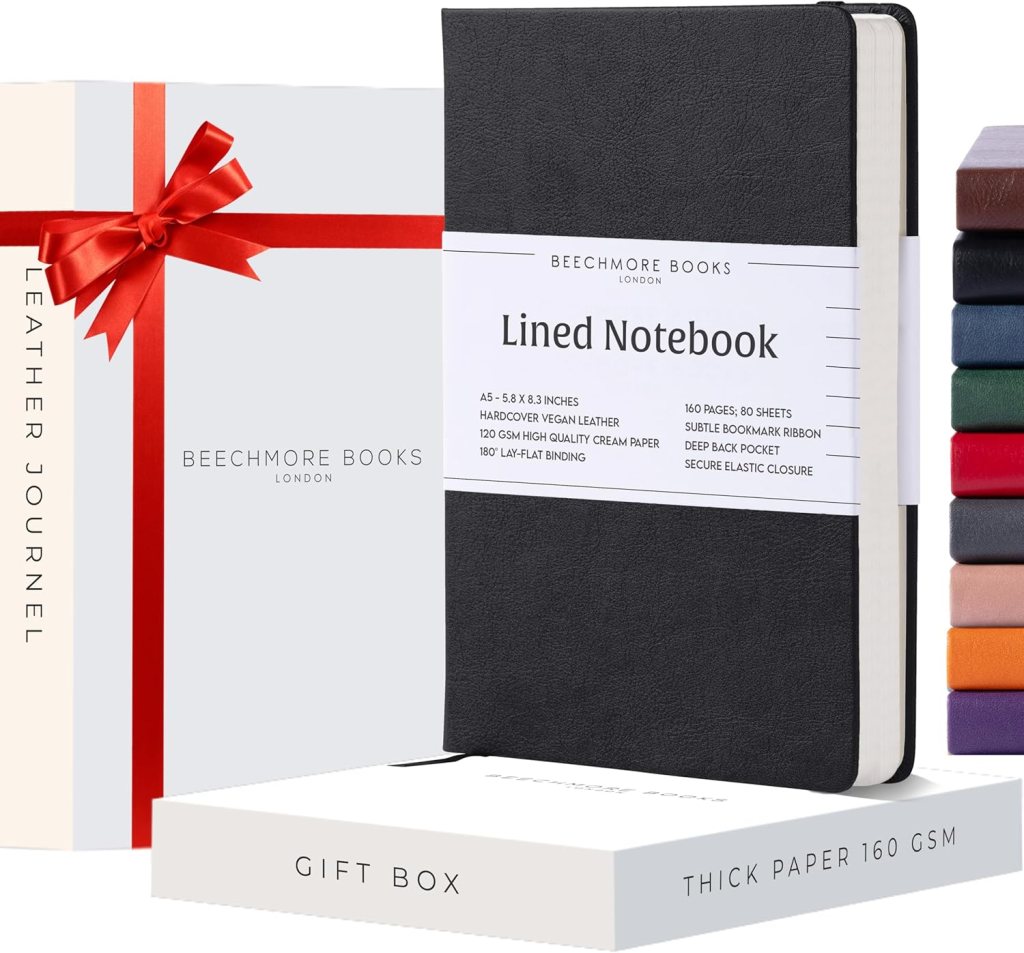 Beechmore Books. Journal Notebooks. Leather Journals. Several colours stacked. White gift box with red ribbon. Black Notebook featured.